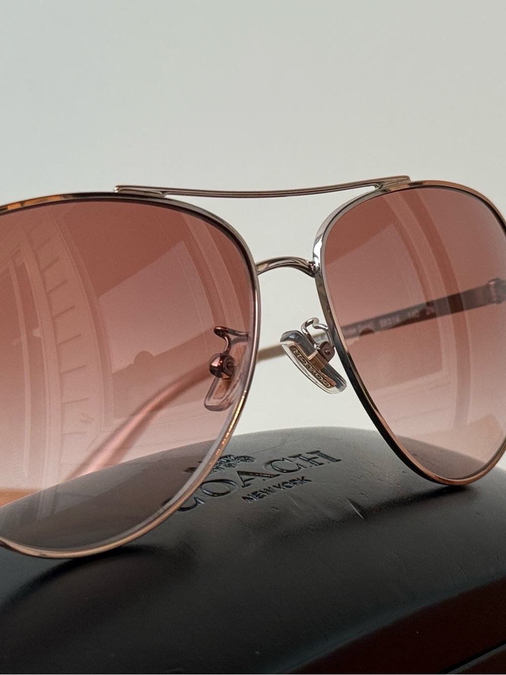 Coach Women’s Rose Gold Aviator Sunglasses with Brown Gradient Lenses
